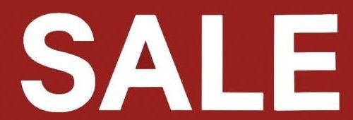 An eye catching sale sign with 'SALE' in white, advertising Black Friday appliance deals in Charleston.