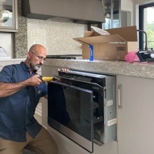 A professional technician of 911 Service Today is doing appliance repair in Charleston