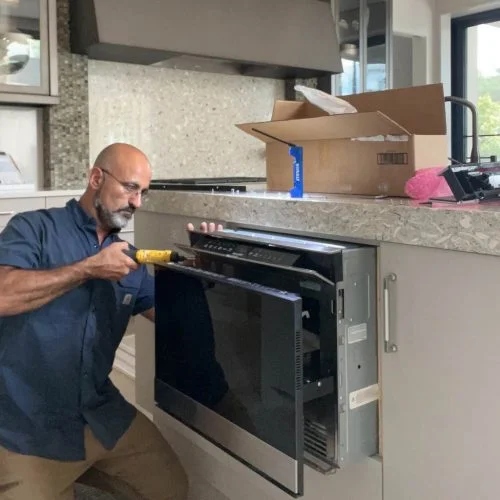 A professional technician of 911 Service Today is doing appliance repair in Charleston