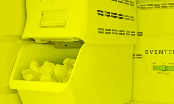 Interior view of an open refrigerator with an ice maker and ice bin, relevant for freezer repair in Charleston, Summerville.