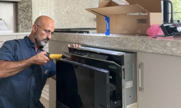 A professional technician of 911 Service Today is doing appliance repair in Charleston